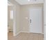 Inviting entryway featuring a white door and neutral-toned flooring at 11934 Wild Chamomile St, Las Vegas, NV 89183