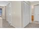 This hallway has neutral paint and carpet and leads to a bathroom and bedroom at 11934 Wild Chamomile St, Las Vegas, NV 89183