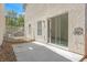 A concrete patio features a metal fence and sliding glass door leading into the home's interior at 11934 Wild Chamomile St, Las Vegas, NV 89183