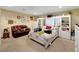 Cozy bedroom featuring a large bed, seating area, and ample storage, creating a comfortable and inviting space at 1312 Rawhide St, Las Vegas, NV 89119