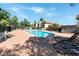Sparkling community pool surrounded by seating, providing a relaxing and enjoyable recreational amenity at 1312 Rawhide St, Las Vegas, NV 89119