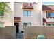 Charming townhome entrance featuring secure gated front yard and desert landscaping at 1312 Rawhide St, Las Vegas, NV 89119