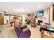 View of living area featuring tile floor, fire place, and kitchen at 1312 Rawhide St, Las Vegas, NV 89119