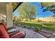 Serene backyard view from the covered patio, showcasing lush lawn and mature trees at 1432 Castle Crest Dr, Las Vegas, NV 89117