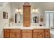 Bathroom with a double sink vanity, white countertops and framed mirrors at 1432 Castle Crest Dr, Las Vegas, NV 89117