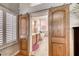 A stylish bathroom doorway that features sliding barn doors and plantation shutters at 1432 Castle Crest Dr, Las Vegas, NV 89117