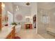 Bright bathroom featuring a soaking tub, walk-in shower, and makeup vanity at 1432 Castle Crest Dr, Las Vegas, NV 89117