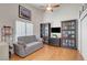 Bedroom featuring hardwood floor, vaulted ceiling, and built-in shelves at 1432 Castle Crest Dr, Las Vegas, NV 89117