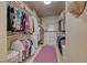 Spacious walk-in closet with custom shelving and ample storage for clothes and accessories at 1432 Castle Crest Dr, Las Vegas, NV 89117