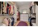 Organized walk-in closet featuring built-in storage and purple accent rug at 1432 Castle Crest Dr, Las Vegas, NV 89117