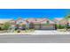 Lovely single-story home with desert landscaping, stone accents, two-car garage, and private gated entry at 1432 Castle Crest Dr, Las Vegas, NV 89117