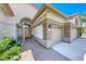 Close-up of home showcasing the tile roof, stucco, stone accents, and private gated entry at 1432 Castle Crest Dr, Las Vegas, NV 89117