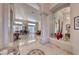 Elegant foyer with tile floors leading to spacious living and dining areas at 1432 Castle Crest Dr, Las Vegas, NV 89117