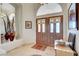 Inviting home foyer features double doors, marble floors, high ceilings and natural light at 1432 Castle Crest Dr, Las Vegas, NV 89117