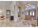 Spacious foyer with tile floors, arched doorways, and decorative inlays at 1432 Castle Crest Dr, Las Vegas, NV 89117