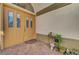 A charming entryway with double doors, brick flooring, and space for decorations at 1432 Castle Crest Dr, Las Vegas, NV 89117