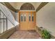 A charming entryway with double doors, brick flooring, and space for decorations at 1432 Castle Crest Dr, Las Vegas, NV 89117