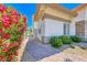 Charming walkway leading to a well-maintained home with colorful landscaping and stone accents at 1432 Castle Crest Dr, Las Vegas, NV 89117