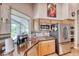 Kitchen featuring stainless steel appliances, and a view of the backyard and covered patio at 1432 Castle Crest Dr, Las Vegas, NV 89117