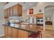 Modern kitchen with stainless steel appliances, granite countertops, and a breakfast bar at 1432 Castle Crest Dr, Las Vegas, NV 89117