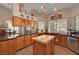Spacious kitchen with stainless steel appliances, granite countertops, and center island at 1432 Castle Crest Dr, Las Vegas, NV 89117