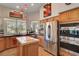 Bright kitchen with an island, stainless appliances, and ample storage at 1432 Castle Crest Dr, Las Vegas, NV 89117