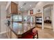 Spacious kitchen boasting stainless steel appliances, granite countertops, and a central island at 1432 Castle Crest Dr, Las Vegas, NV 89117