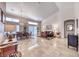 Open-concept living and dining area featuring tile floors and large windows at 1432 Castle Crest Dr, Las Vegas, NV 89117