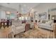 Spacious living room featuring tile floors and a seamless transition to the kitchen and dining areas at 1432 Castle Crest Dr, Las Vegas, NV 89117