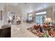 Spacious open-plan living and dining area with tile floors and ample natural light at 1432 Castle Crest Dr, Las Vegas, NV 89117