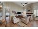 Bright living room featuring high ceilings, stone fireplace, media center, tile floors and lots of light at 1432 Castle Crest Dr, Las Vegas, NV 89117