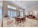 Open-concept living area features a vaulted ceiling, modern lighting, and tile flooring at 1432 Castle Crest Dr, Las Vegas, NV 89117