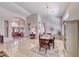Bright living area with gorgeous chandelier, tile flooring, and views of the entrance at 1432 Castle Crest Dr, Las Vegas, NV 89117