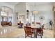Spacious living and dining area with chandelier, open floor plan and lots of natural light at 1432 Castle Crest Dr, Las Vegas, NV 89117