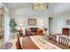 Bright living room with high ceilings, elegant chandelier, and classic furnishings at 1432 Castle Crest Dr, Las Vegas, NV 89117