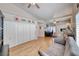 Spacious living room featuring hardwood floors, comfortable seating, and ample storage at 1432 Castle Crest Dr, Las Vegas, NV 89117