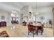 Open-concept living and dining area with beautiful tile flooring and plenty of natural light at 1432 Castle Crest Dr, Las Vegas, NV 89117
