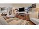 Open living area with media center, comfortable seating, and a neutral color palette at 1432 Castle Crest Dr, Las Vegas, NV 89117