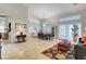 Spacious living and dining areas featuring high ceilings, large windows, and an open floor plan at 1432 Castle Crest Dr, Las Vegas, NV 89117
