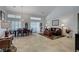 Bright, open-concept living and dining areas with elegant finishes, high ceilings, and lots of natural light at 1432 Castle Crest Dr, Las Vegas, NV 89117