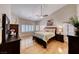 This main bedroom has hardwood floors, shuttered windows, and a ceiling fan at 1432 Castle Crest Dr, Las Vegas, NV 89117