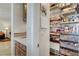Well-organized pantry features ample shelving, keeping ingredients and cooking essentials neatly stored at 1432 Castle Crest Dr, Las Vegas, NV 89117