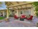 Relaxing covered patio with comfortable seating, creating an inviting outdoor living space at 1432 Castle Crest Dr, Las Vegas, NV 89117