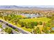 Aerial view of a neighborhood with large green space, walking trail and recreation area at 1540 Singing Bird Ln, North Las Vegas, NV 89031