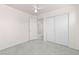 This bright bedroom features a fan, closet, and ensuite bathroom at 1540 Singing Bird Ln, North Las Vegas, NV 89031