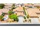Aerial view of home with desert landscaping, two-car garage, and neutral color scheme at 1540 Singing Bird Ln, North Las Vegas, NV 89031