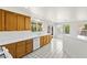 Bright kitchen with ample counter space, oak cabinets, and view to the backyard at 1540 Singing Bird Ln, North Las Vegas, NV 89031