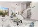 Bright living room with high ceilings, an open staircase, and dining area at 1540 Singing Bird Ln, North Las Vegas, NV 89031