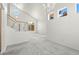 Open living area with carpet and staircase at 1540 Singing Bird Ln, North Las Vegas, NV 89031