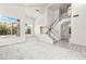 Bright, airy living room features large windows, high ceilings and staircase to the second level at 1540 Singing Bird Ln, North Las Vegas, NV 89031